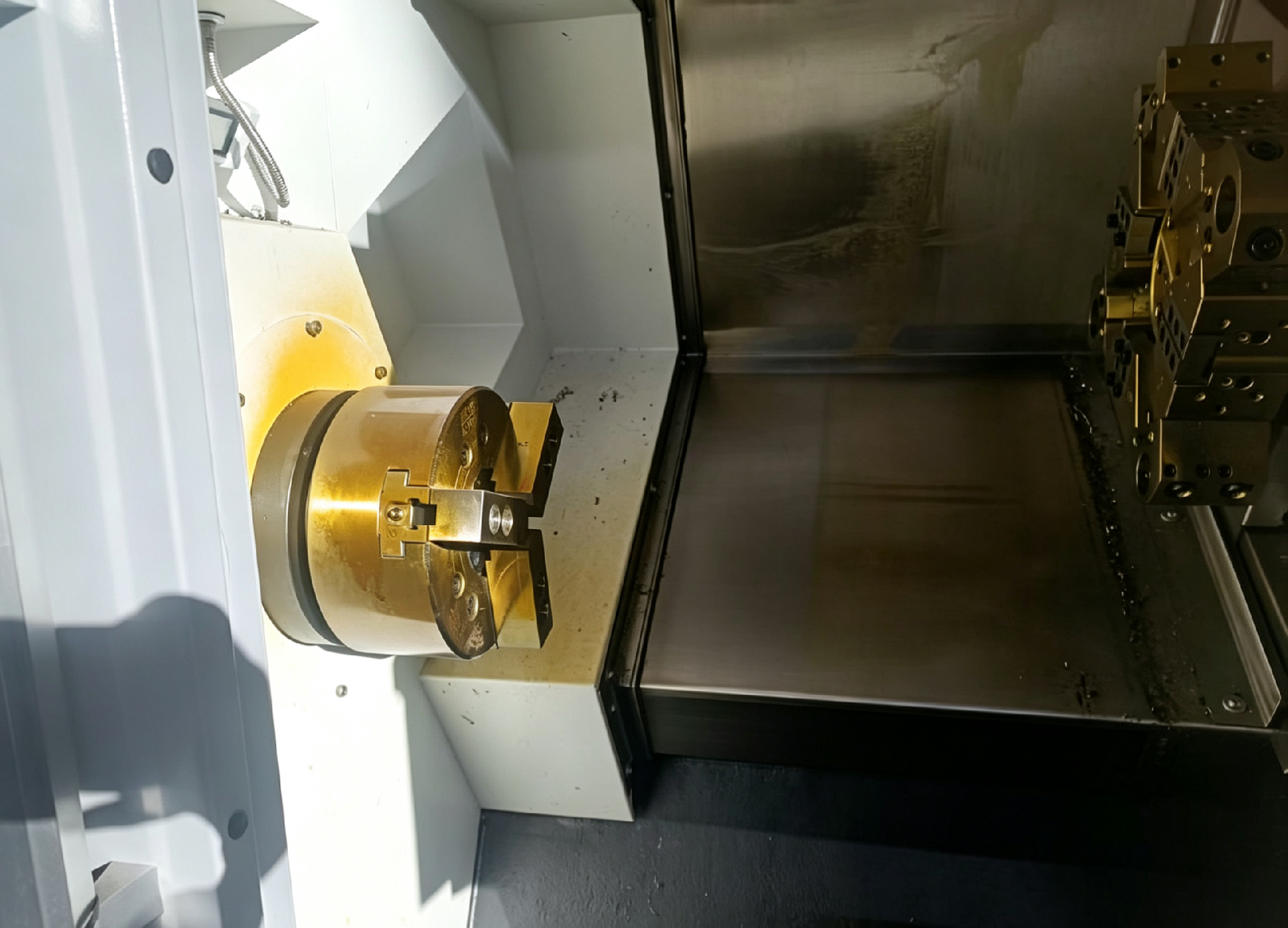 TCK50 slant bed lathe interior showing the 8-station horizontal turret and 8-inch chuck on the A2-6 spindle